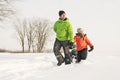 A cool Father drag his boy in sled