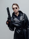 Cool female spy holding a gun