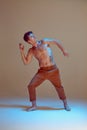 Cool flexible young man dancer dancing in neon light. Dance school poster. Dance lessons. Body with tattoos. Royalty Free Stock Photo