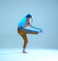 Cool flexible young man dancer dancing without shirt in neon blue light. Dance school poster. Dance lessons Royalty Free Stock Photo