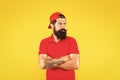 Cool and free man. Serious man yellow background. Bearded man keep hands crossed with confidence. Caucasian man with