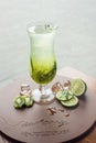 Fruit lemonade in hurricane glass with kiwi and lime Royalty Free Stock Photo