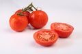 Cool fresh sliced tomatoes on white background Royalty Free Stock Photo