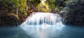 Cool fresh water pond in forest with smooth and silky waterfall