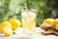 Cool freshly made lemonade and fruits on white wooden table, closeup Royalty Free Stock Photo
