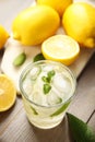 Cool freshly made lemonade and fruits on wooden table, above view Royalty Free Stock Photo