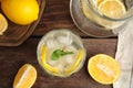 Cool freshly made lemonade and fruits on wooden table, flat lay Royalty Free Stock Photo