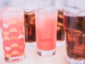 Cool fruit juice with soft focus sparkling water foreground and