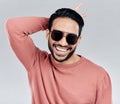 Cool, funny and funky Asian man with sunglasses isolated on a white background in a studio. Portrait, comic and a