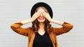 Cool girl closes eyes cute smiling wearing a vintage elegant hat