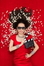 Cool Girl with 3D Cinema Glasses, Popcorn and Director Clapboard