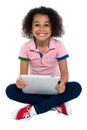 Cool girl kid sitting on the floor Royalty Free Stock Photo