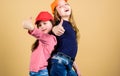 Cool girls. Little cute girls wearing bright baseball caps. Modern fashion. Stylish accessory. Kids fashion. Feeling