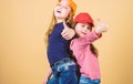 Cool girls. Little cute girls wearing bright baseball caps. Modern fashion. Stylish accessory. Kids fashion. Feeling