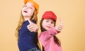 Cool girls. Little cute girls wearing bright baseball caps. Modern fashion. Hats and caps. Stylish accessory. Kids