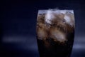 Cool glass of cola drink with ice, bubbles and fizz Royalty Free Stock Photo