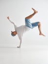 Cool guy breakdancer dancing lower break dance isolated on white background. Dance school poster. Break dance lessons Royalty Free Stock Photo