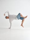 Cool guy breakdancer dancing lower break dance isolated on white background. Break dance lessons Royalty Free Stock Photo