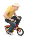 Cool guy goes on a children's bicycle