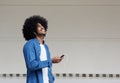 Cool guy listening to music on mobile phone Royalty Free Stock Photo