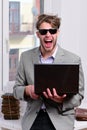 Cool guy sits on table and works. Working online concept Royalty Free Stock Photo