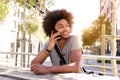 Cool guy sitting outside talking on cell phone Royalty Free Stock Photo