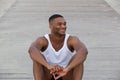 Cool guy smiling and sitting outdoors Royalty Free Stock Photo