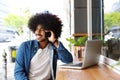 Cool guy using mobile phone and laptop Royalty Free Stock Photo