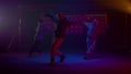 Cool guys dancing hiphop in flashing backlights. Dancers performing on stage. Royalty Free Stock Photo