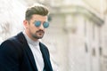 Cool handsome fashion young man. Stylish man with sunglasses Royalty Free Stock Photo