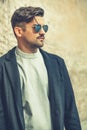 Cool handsome fashion young man. Stylish man with sunglasses Royalty Free Stock Photo