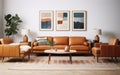 Cool interior design. Mid-century modern living room with tan leather sofa, geometric rug and vintage art prints. Indoor plants. Royalty Free Stock Photo