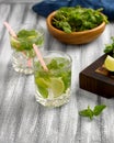 Cool lemonade with mint and lime and ice in glass cups Royalty Free Stock Photo