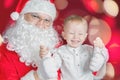 Cool little boy and Santa Claus at Christmas holiday Royalty Free Stock Photo