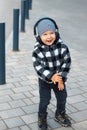 Cool little boy 2-3 years old enjoying his favorite music in headphones Royalty Free Stock Photo