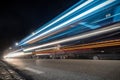 Cool long exposure bus traffic neon blue-orange light trails, night view on the street road, Rome, Italy Royalty Free Stock Photo