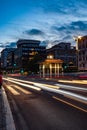 Cool long exposure bus traffic neon blue-orange light trails, night view on the street road, Rome, Italy Royalty Free Stock Photo