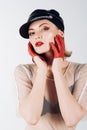 Cool look of girl with fashionable makeup. Girl in leather cap. Trendy girl in rock style. Rock woman with blonde Royalty Free Stock Photo