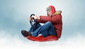 Cool man on a sled with a steering wheel Royalty Free Stock Photo