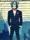 A cool monkey in a tuxedo with a red bow tie