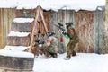 Cool paintball in winter. Two shooters behind fortifications. Royalty Free Stock Photo