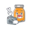 Cool Photographer apple jam character with a camera Royalty Free Stock Photo