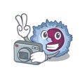 Cool Photographer monocyte cell character with a camera