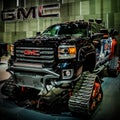 Cool picture of majesty GMC Sierra truck on caterpillar tracks , Chicago Autoshow 02/17/2019