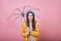 Cool pretty girl in yellow rain jacket with umbrella Royalty Free Stock Photo