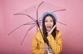 Surprised girl in gentle blue beret and striped blouse with umbrella in hands Royalty Free Stock Photo