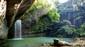 A cool refreshing waterfall into an emerald pond hidden in a mysterious forest of lush greenery ~ River Scenery of Taiwan Royalty Free Stock Photo