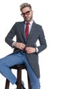 Cool sexy businessman unbuttoning his coat Royalty Free Stock Photo