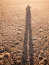 Cool silhouette reflection shadow shade in sand beach cobble tex Royalty Free Stock Photo