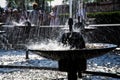 Cool splashes of water from a city fountain in hot summer weather. Long exposure. Contrast and close-up